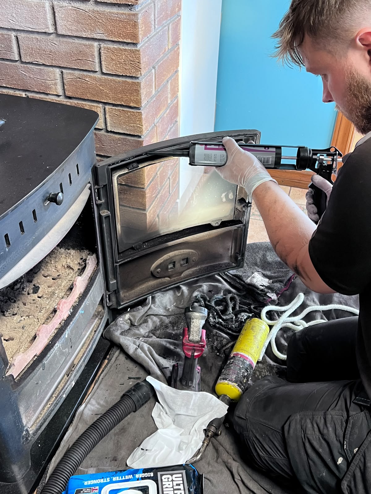 Stove door rope being replaced